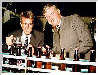 James Arkell and Michael Wills MP celebrate the opening of the new bottling plant