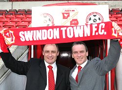 Swindon Town's Maurice Malpas and Dave Byrne