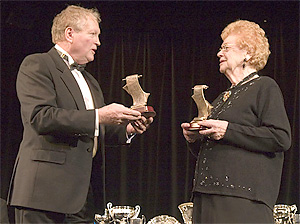 Joan Cheshire receiving her commemorative trophy