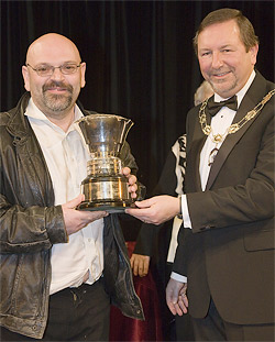 Whole Hog: Director, Phil Regan accepts the winner's trophy from Swindon's Deputy Mayor, Cllr David Wren