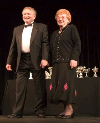 Martin Clifton and Joan Cheshire on stage for the presentation of awards in 2007