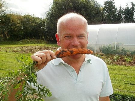 Peter enjoying a home-grown carrott