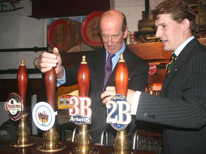 Duke of Kent pulls the first pint at Arkell's brewery in Swindon