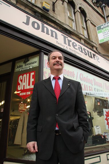 Peter Treasure outside John Treasure Tailor's in Swindon