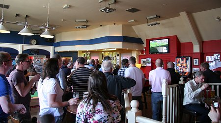 Swindon fans watch the Johnstone's Paint Trophy Final