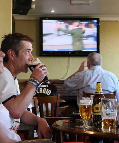 Swindon fans watch the Johnstone's Paint Trophy Final at the New Inn