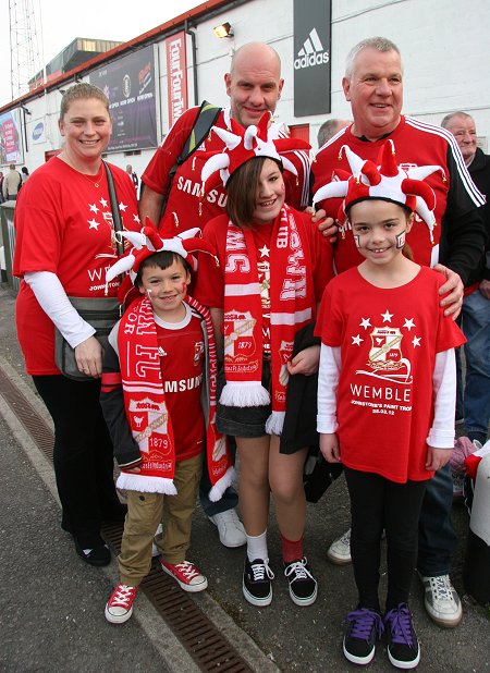 Swindon fans leave for Wembley from the County Ground