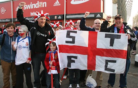 Swindon fans leave for Wembley from the County Ground