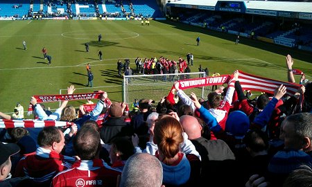 Swindon fans celebrate promotion at Gillingham