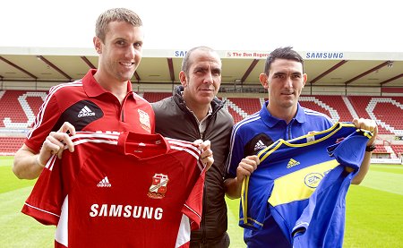 New Swindon signings Gary Roberts (l) and Andy Williams, with Paolo Di Canio