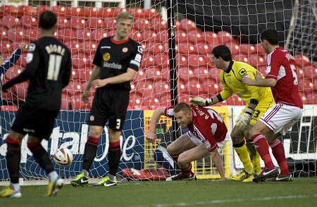 Adam Rooney scores for Swindon against Crewe