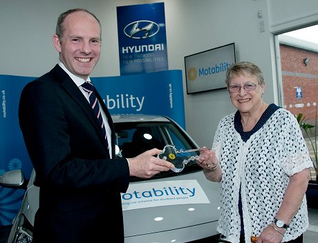 Justin Tomlinson MP North Swindon presents the keys to Madge Trinder at Pebley Beach Swindon