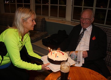 Guinness Jim receives his birthday cake from Verity Brooke-Maples