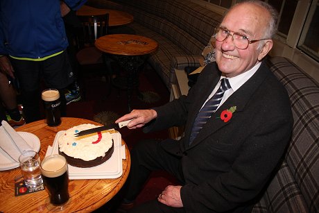 Guinness Jim cuts his birthday cake