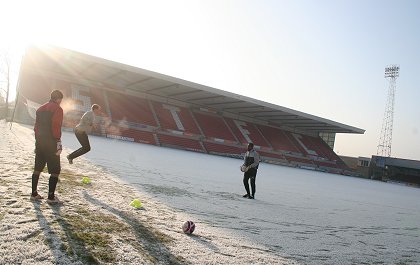 Swindon Town footballers training in the frost at the County Ground