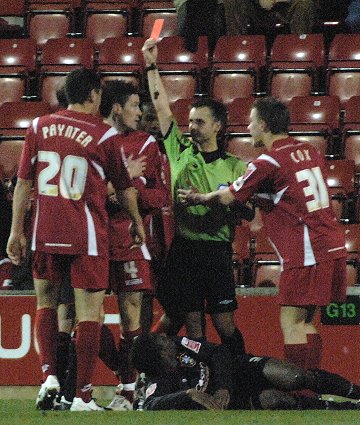 Lee Peacock for Swindon Toen Football Club gets a red card