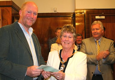TWIGS Alan Holland receiving his cheque from Swindon Mayoress Sue Barnes