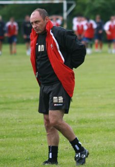 Swindon Town boss Maurice Malpas puts the boys through their paces at pre-season training