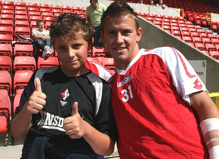 Swindon Town's Simon Cox meets with fans