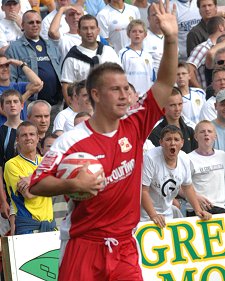 Swindon Town's Simon Cox scores against Leeds United