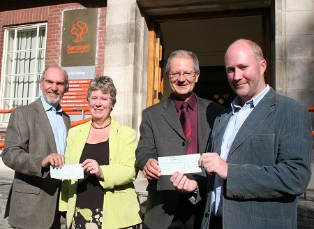 Former Swindon Mayor Michael Banrnes presents cheques to Swindon Cares and TWIGS