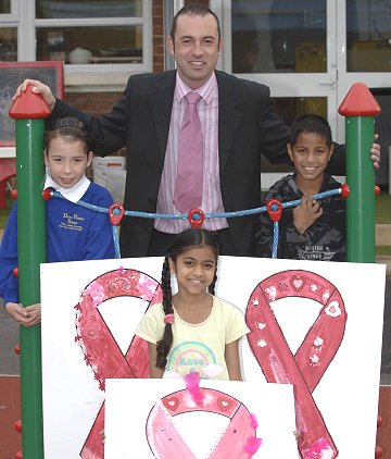 Pupils at Drove Primary School with Swindon Designer Outlet's Nick Williams