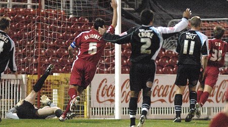 Simon Cox scores the second for Swindon Town