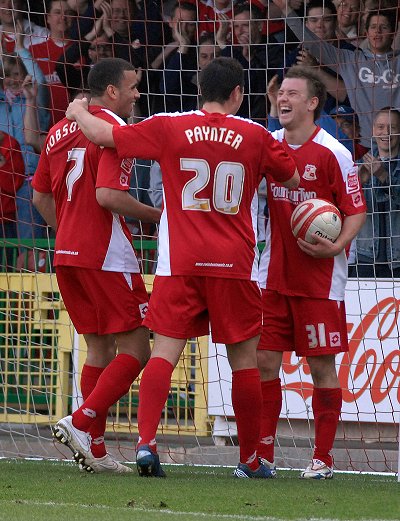 Simon Cox, Billy Paynter and Hal Robson-Kanu celebrate Swindon's second goal