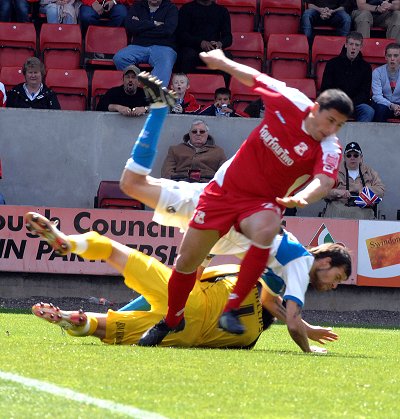 Byron Anthony takes a tumble during Swindon Town v Bristol Rovers 25 April 2009