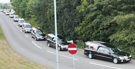 Repatriation funeral courtege negotiates the White Hart roundabout