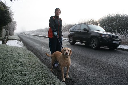 Lady walking her dog on the A361, Swindon, frosted over 2009