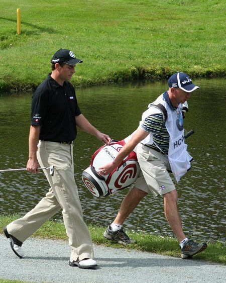 David Howell and caddy on the 8th hole at Wentworth