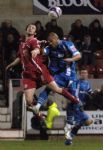 Ex-Orient player, now Town defender, Craig Easton wins a header